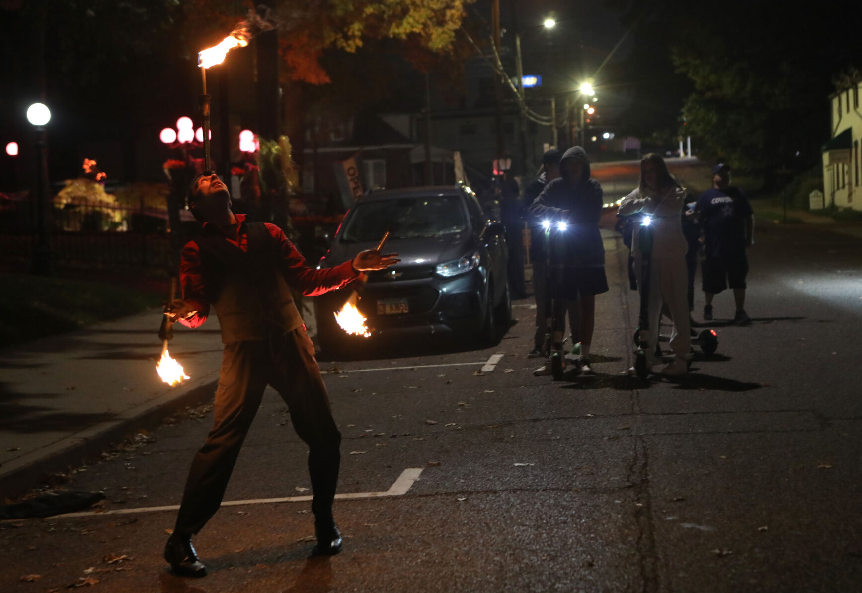 Elliot Pearsall juggles torches